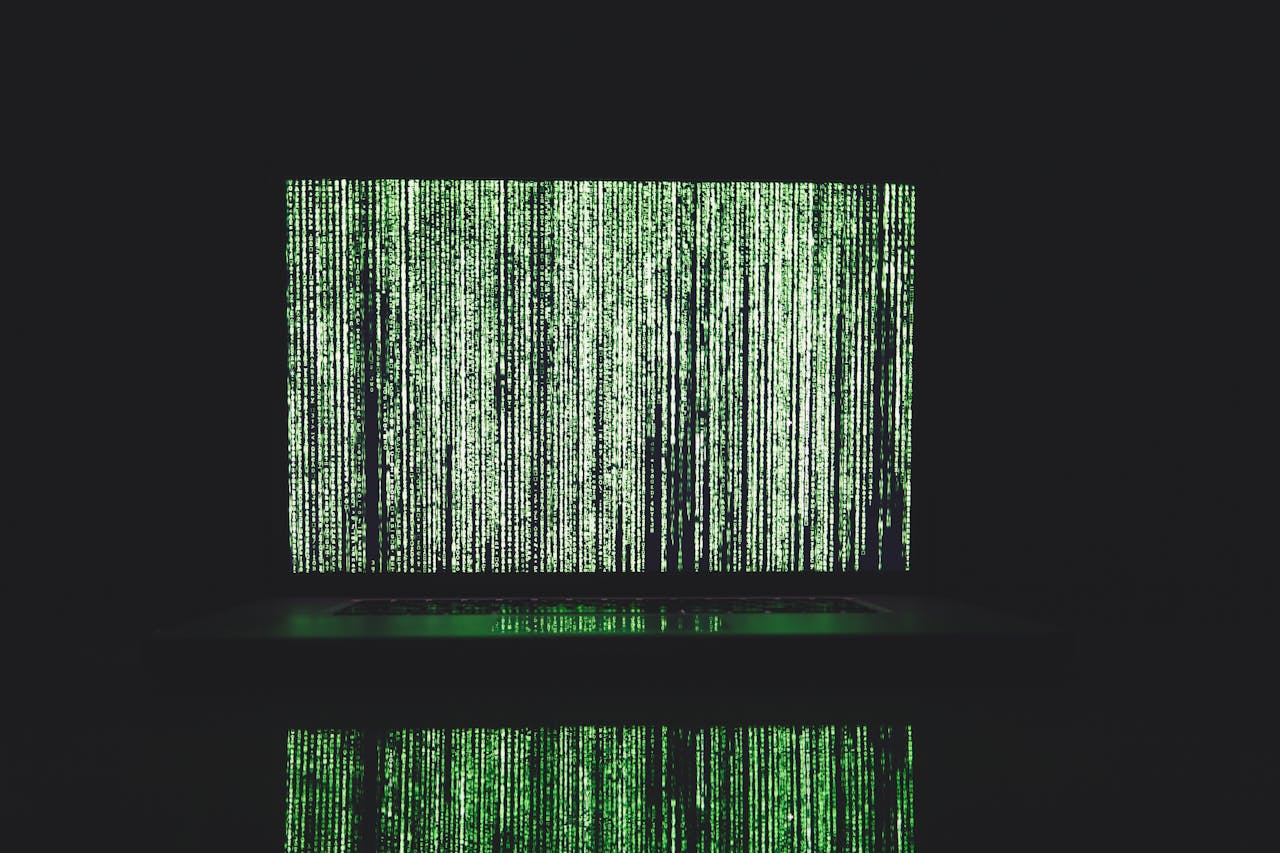 our-story Abstract depiction of green matrix code on a computer monitor.