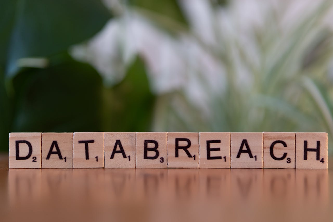 gallery-04 Close-up of Scrabble tiles spelling 'data breach' on a blurred background